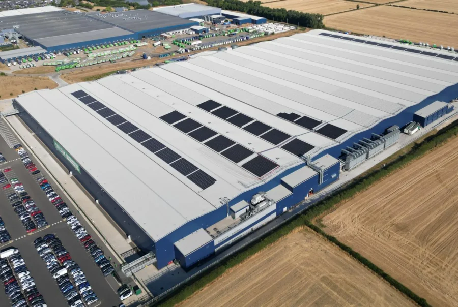 An aerial photo of Wren Kitchens' factory in Barton upon Humber, showing the partly completed installation of solar panels on the roof.