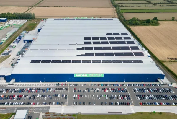 Wren Kitchens' facility shot from a distance from a dron with a solar panel installation programme about 1/3 of the way through.